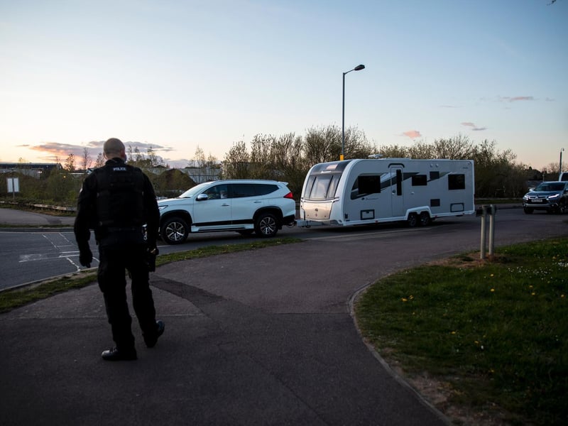 A fleet of around 30 travellers were escorted out of Ross Road by police