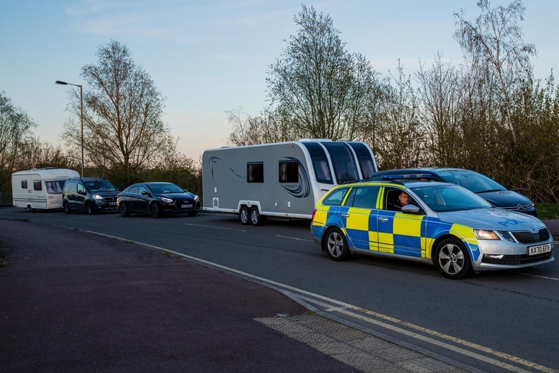 A fleet of around 30 travellers were escorted out of Ross Road by police