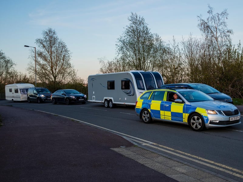 A fleet of around 30 travellers were escorted out of Ross Road by police
