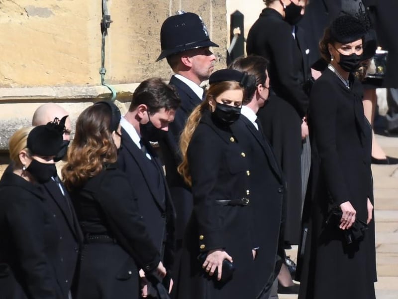 Zara Tindall, Mike Tindall, Princess Eugenie, Jack Brooksbank, Princess Beatrice, Edoardo Mapelli Mozzi, Catherine, Duchess of Cambridge and Camilla, Duchess of Cornwall stand outside St George's Chapel.