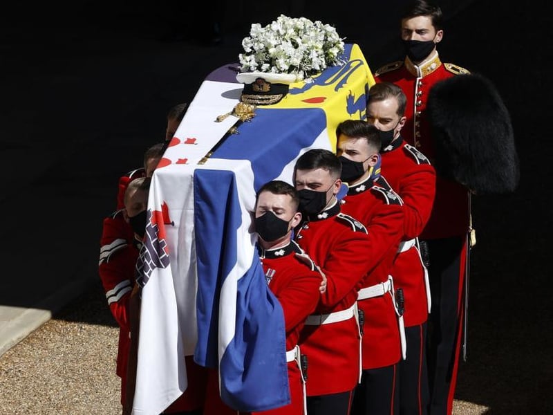 The bearer Party found by The Queen’s Company, 1st Battalion Grenadier Guards carry the coffin of HRH Prince Philip to the purpose built Land Rover Hearse during the Duke of Edinburgh's funeralWindsor Castle. Photos; Getty Images