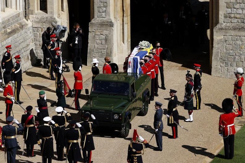 The Duke of Edinburgh’s coffin, covered with His Royal Highness’ Personal Standard is carried to the purpose built Land Rover