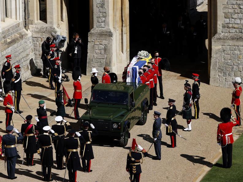 The Duke of Edinburgh’s coffin, covered with His Royal Highness’ Personal Standard is carried to the purpose built Land Rover