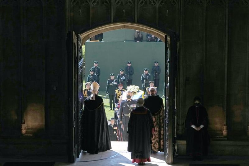 The coffin of Prince Philip, Duke of Edinburgh, is carried into his funeral service at St George's Chapel at Windsor Castle