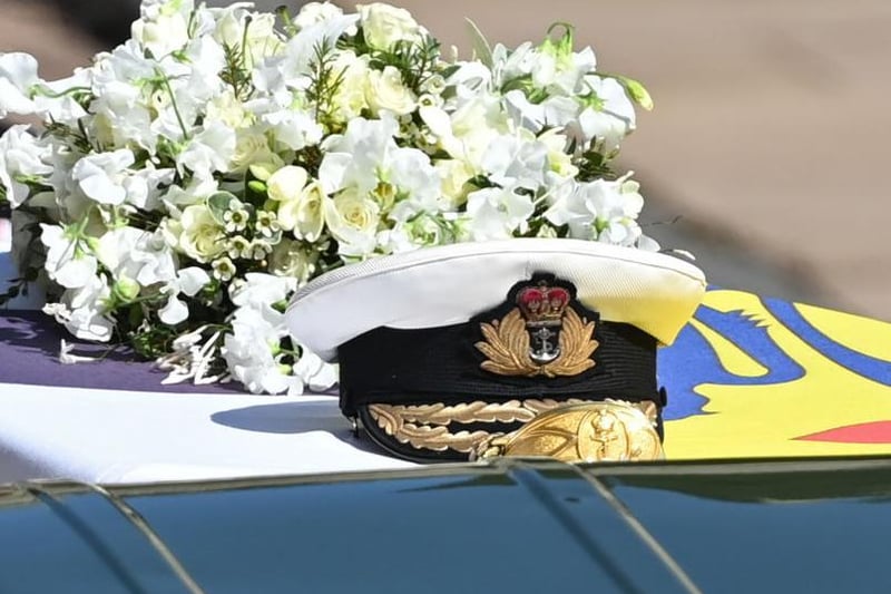 Prince Philip, Duke of Edinburgh's Royal Navy cap sits on his coffin, which covered with His Royal Highness’s Personal Standard during the Ceremonial Procession