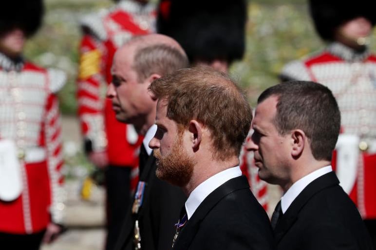 Peter Phillips walks between Princes William and Harry during the Ceremonial Procession to St George's Chapel