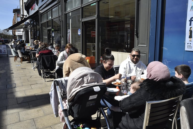 Outdoor dining at the Pizza House in a busy Cowgate on Saturday. Pictures: David Lowndes.