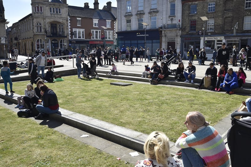 Queues outside Queensgate as shoppers and diners enjoyed a sunny weekend in Peterborough. Pictures: David Lowndes.