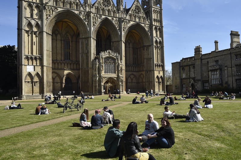 People enjoy the sunny weekend weather in the precincts of Peterborough Cathedral. Pictures: David Lowndes