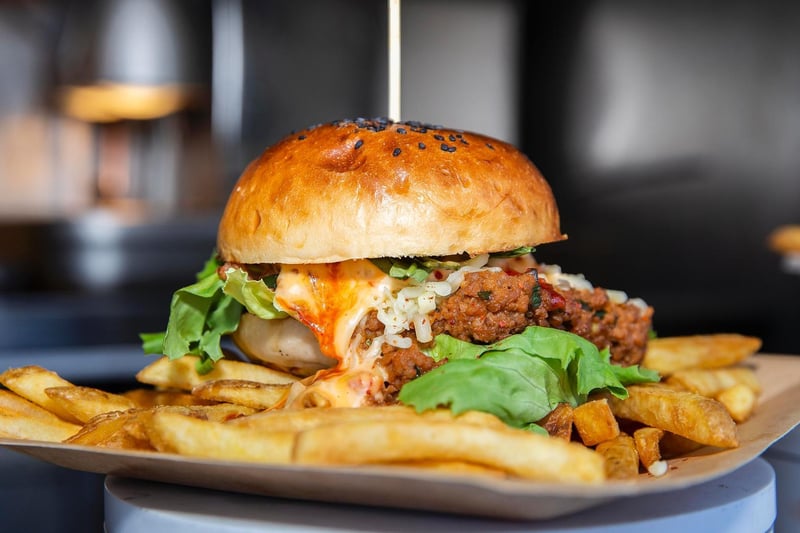 This crispy Korean pork belly burger with fries looks mouth-wateringly scrumptious!