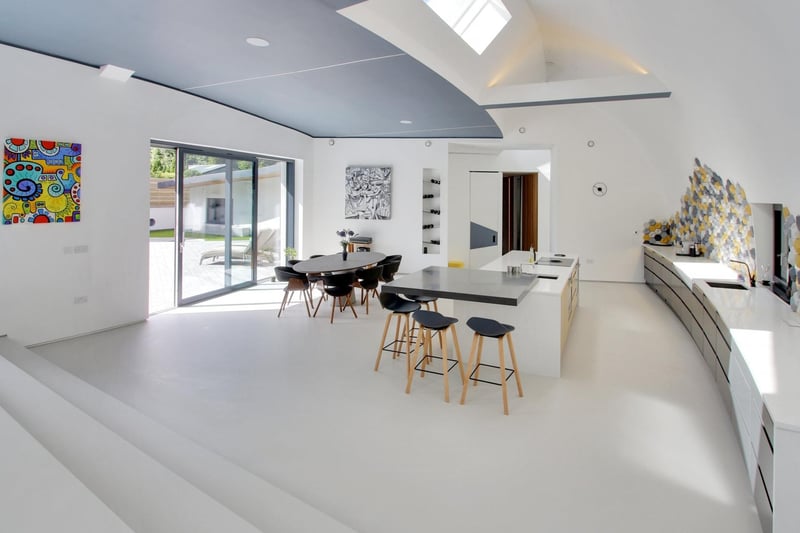 An open-plan living area includes a kitchen-diner and lounge