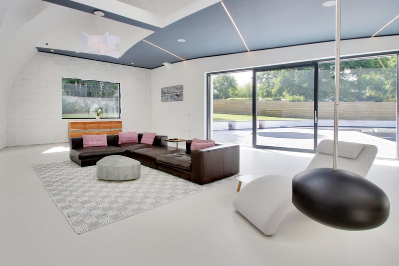 Sliding doors in the living area lead to the landscaped terrace. All windows are said to be triple-glazed