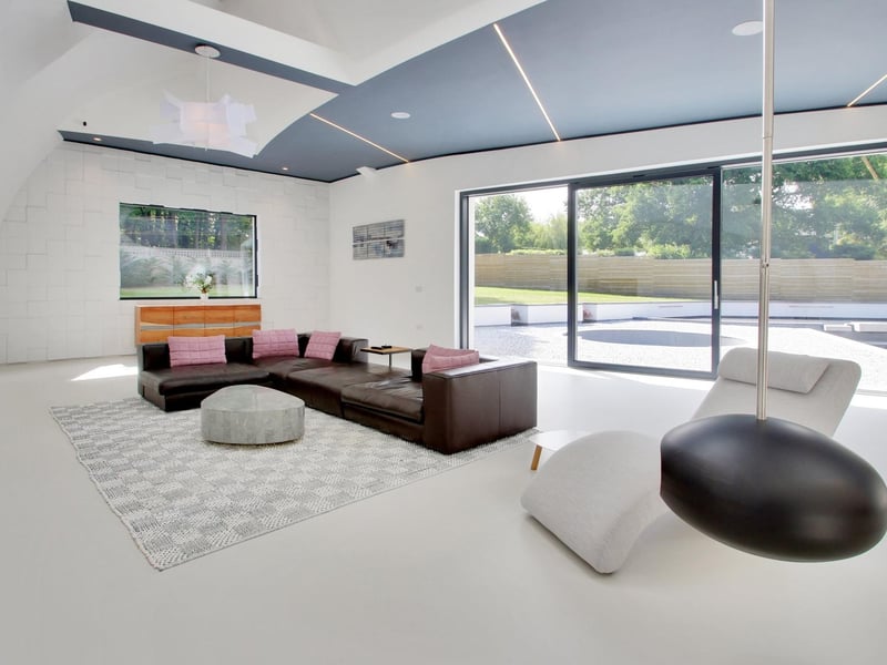 Sliding doors in the living area lead to the landscaped terrace. All windows are said to be triple-glazed
