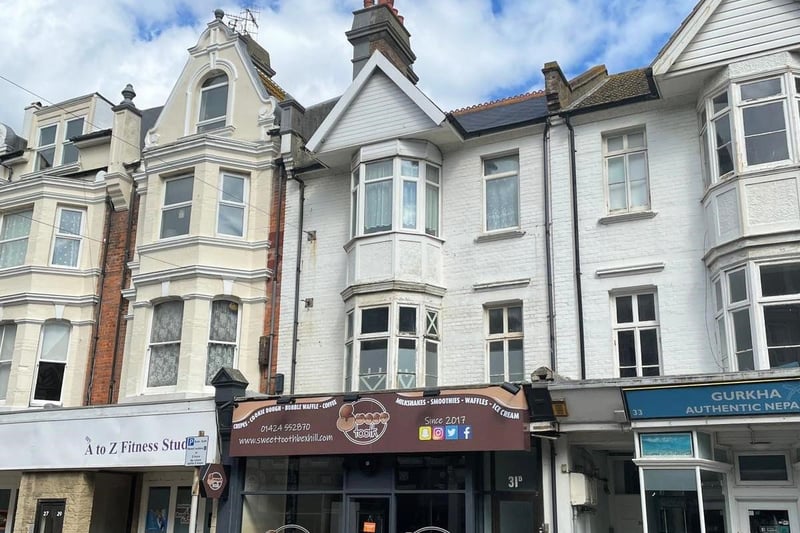 31 Sackville Road, Bexhill: A mixed-use property with a freehold guide price of £260,000 to £270,000. The ground floor is a commercial unit let to Sweet Tooth Bexhill; there is a rear office/ studio space with potential for conversion; the first floor is a former studio/storage space that is said to have planning permission for change of use to a two-bedroom flat; and the second floor houses a two-bedroom flat, currently vacant