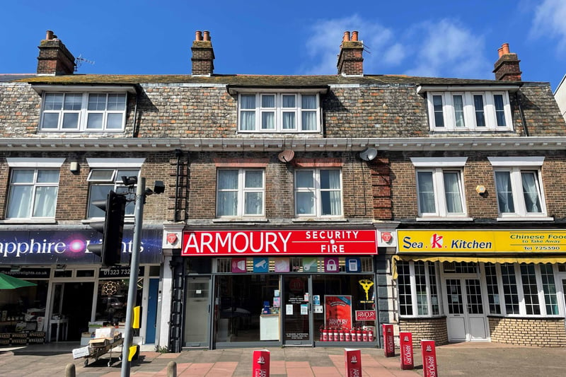 342 Seaside, Eastbourne: A three-storey mixed-use commercial and residential property listed as an investment property. It is offered with a freehold guide price of £300,000 plus. The ground floor is let on a commercial lease and its two flats are holding over on assured shorthold tenancy agreements