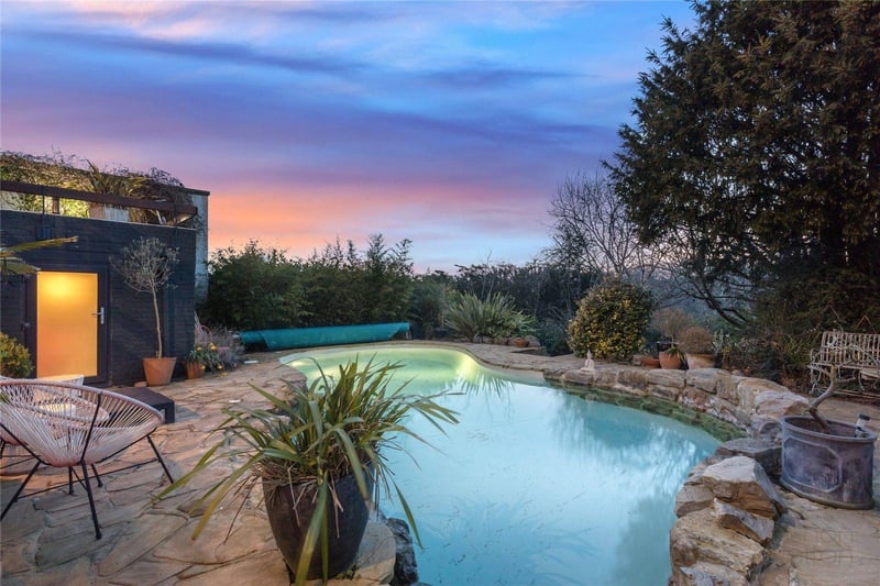 Outside, a sitting sun terrace leads down to the pool terrace, containing a a bespoke designed, heated swimming pool that has been recently renovated and fitted with a low energy heat pump.