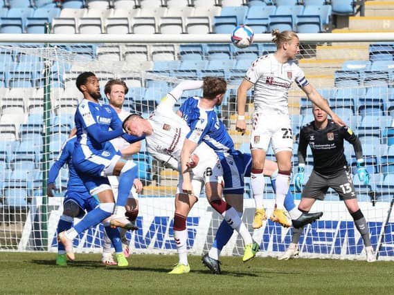 Cobblers' defenders knew they had been in a battle against Gillingham on Saturday. Pictures: Pete Norton.