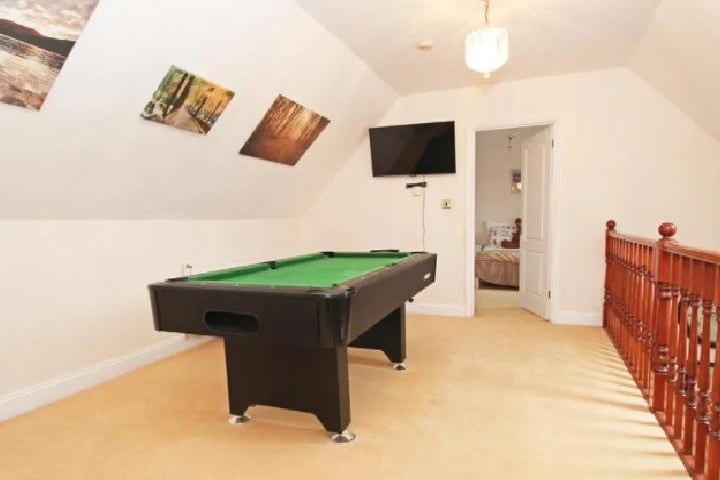 The landing on this property is big enough to fit a pool table comfortably and appealing enough to have a tv placed up there in case you want to hang out upstairs.