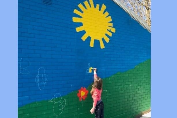Local children helped create the mural
