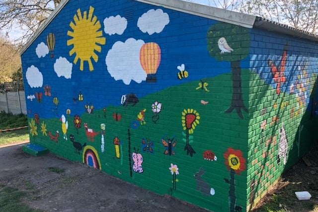 Artistic flair turns old disused changing room block into colourful mural