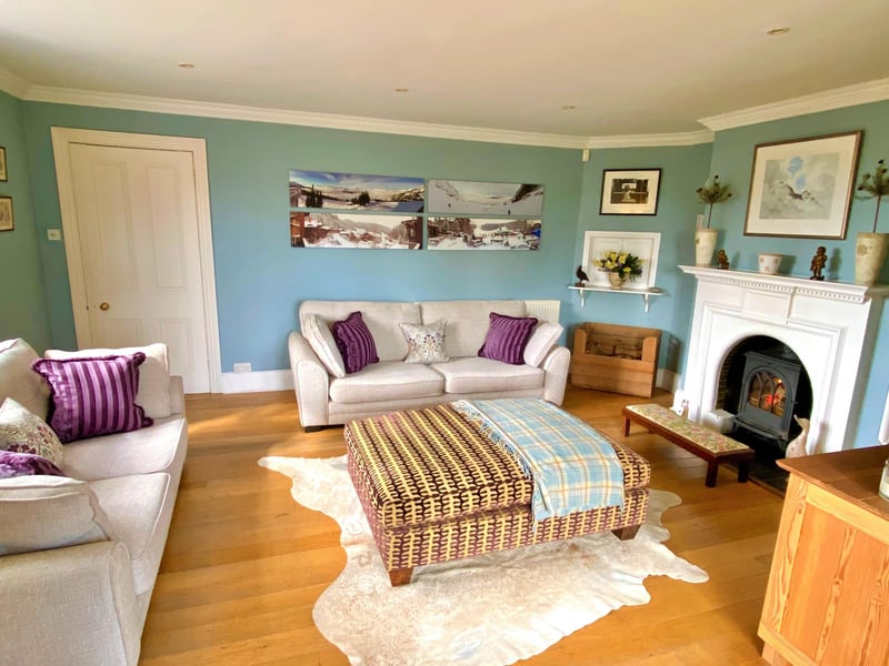 The sitting room with wood burner and French doors leading to the gardens