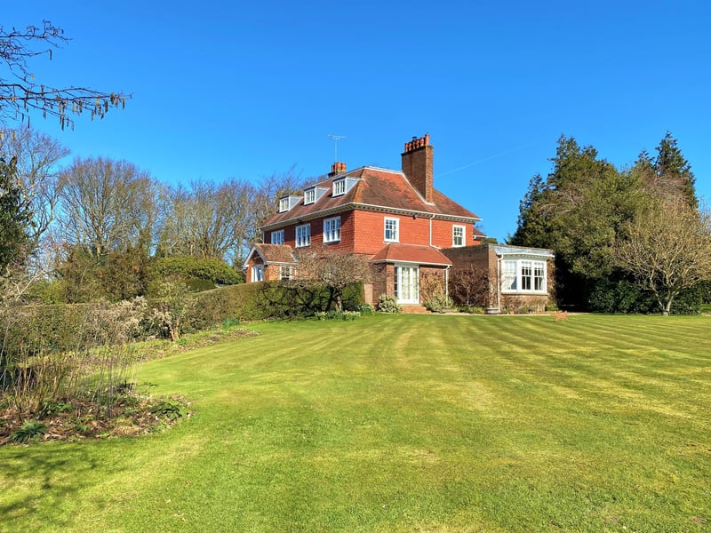 The three-storey property has more than seven acres of grounds, with views over the Brede Valley