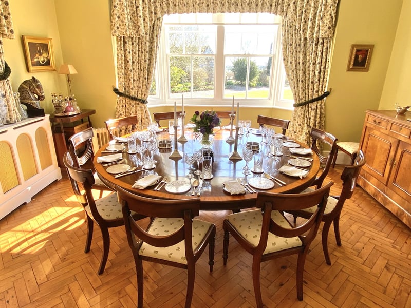 The dining room with parquet flooring, said to be one of the property's original period features