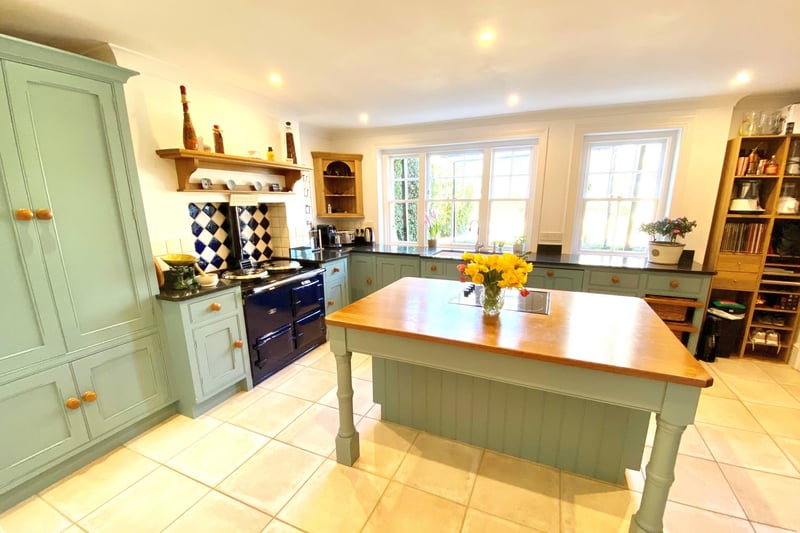 A central island unit and AGA feature in the kitchen-breakfast room. The house also has a wine cellar