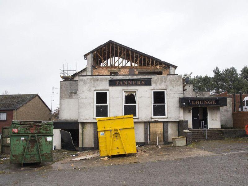 Councillors on Northampton Borough Council’s planning committee unanimously approved the scheme to redevelop The Tanners site in Thorplands, which will see Northampton Partnership Homes (NPH) build on the land.
The site, on Farm Field Court, originally consisted of the pub, which has since been demolished, and a small local centre including retail and takeaways.
The NPH proposal will see 11 houses constructed, as well as six flats. The three-storey flat building would also contain two commercial units. One of these would be used for retail and the second would be made available for use either for retail or as a takeaway.
The abandoned pub was used by homeless people as a shelter and had been broken into several times, attracting attention from the police.