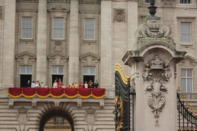 The Royal Family looking out onto the crowds at the private reception. Photo: Yvonne McKeown