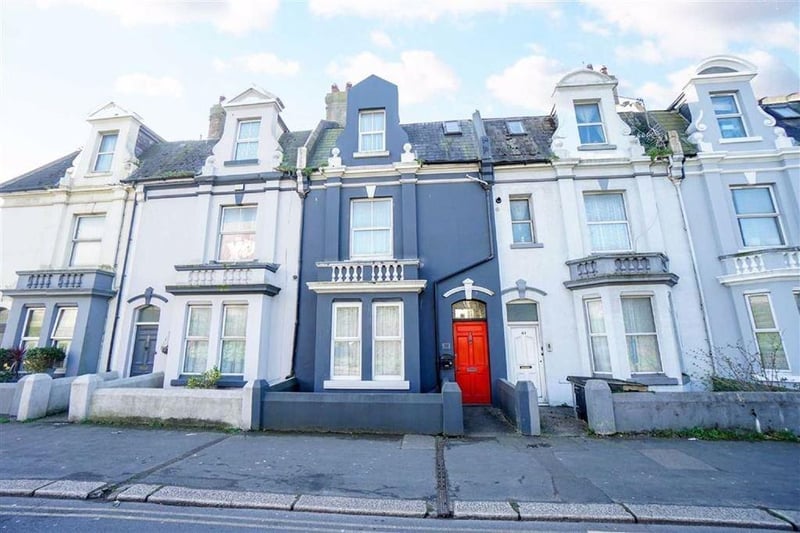 A four bed terraced house. Price: £300,000.