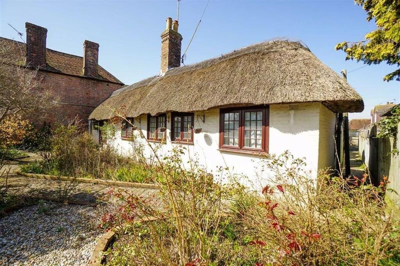 Detached two bed thatched cottage. Price: £300,000.