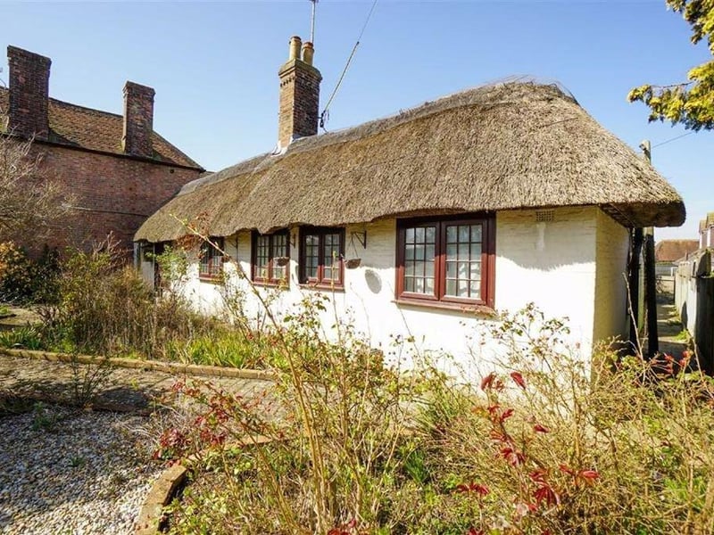 Detached two bed thatched cottage. Price: £300,000.