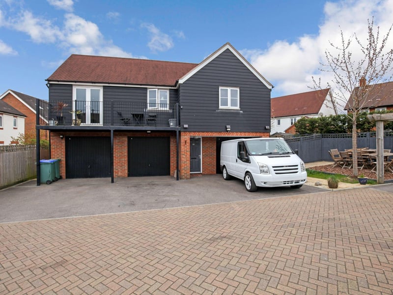 A detached two bed coach house. Price: £290,000.