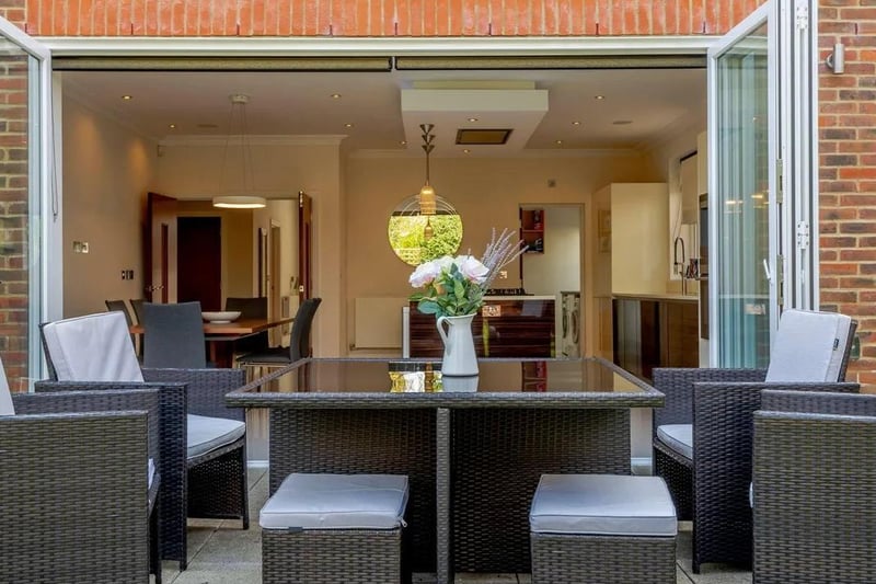 The kitchen/dining room is at the rear with bi-fold doors opening to the rear terrace