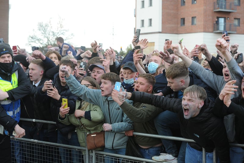 Posh players, staff and fans celebrate outside the Weston Homes Stadium after promotion  to the Championship was clinched in dramatic style. Pictures: David Lowndes.