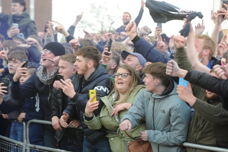 Posh players, staff and fans celebrate outside the Weston Homes Stadium after promotion  to the Championship was clinched in dramatic style. Pictures: David Lowndes.