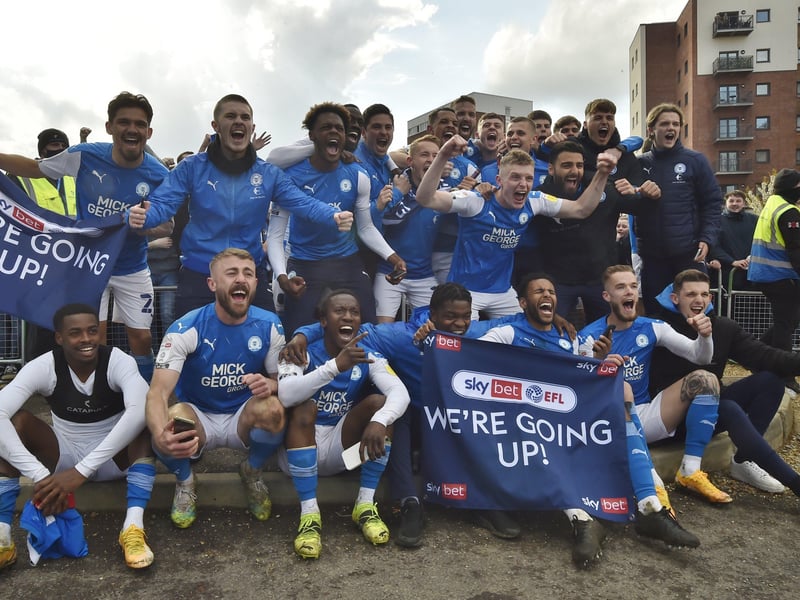 Posh drew with Lincoln City to gain promotion to the Championship triggering huge celebrations with fans outside the Weston Homes Stadium. Pictures: David Lowndes