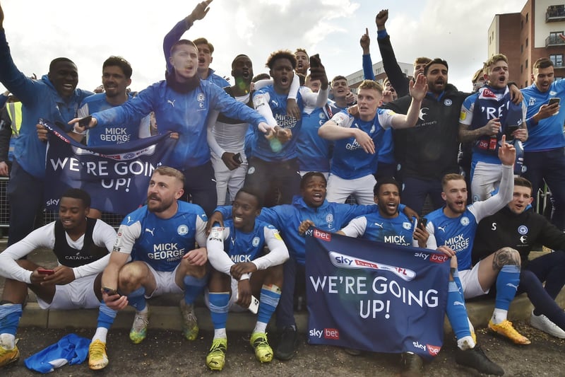 A squad shot as the players celebrate promotion to the Championship outside the Weston Homes Stadium. Photo: David Lowndes.