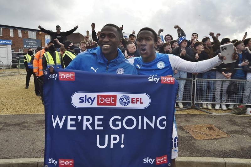 Idris Kanu (left) and Siriki Dembele celebrate in front of excited Posh fans. Photo: David Lowndes.