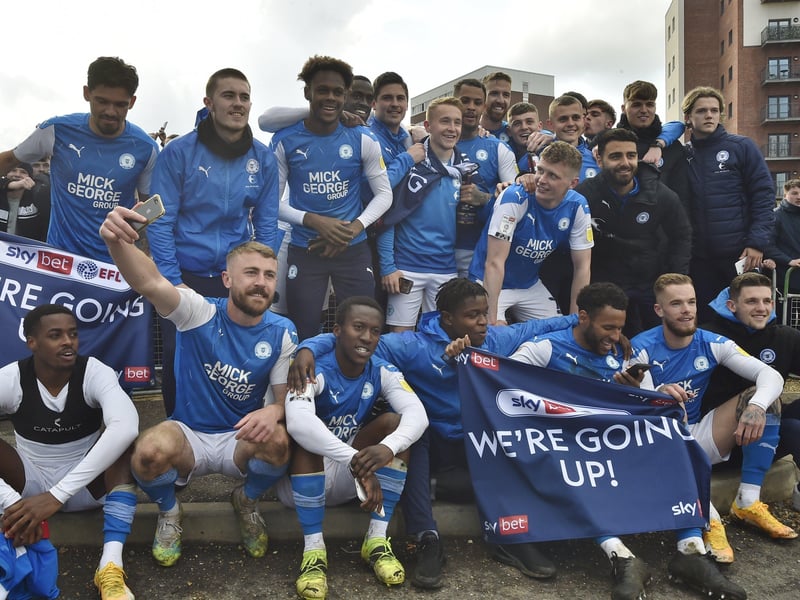 Posh drew with Lincoln City to gain promotion to the Championship triggering huge celebrations with fans outside the Weston Homes Stadium. Pictures: David Lowndes