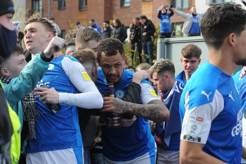 Posh stars Jack Taylor and Jonson Clarke-Harris are mobbed by fans. Photo: David Lowndes.