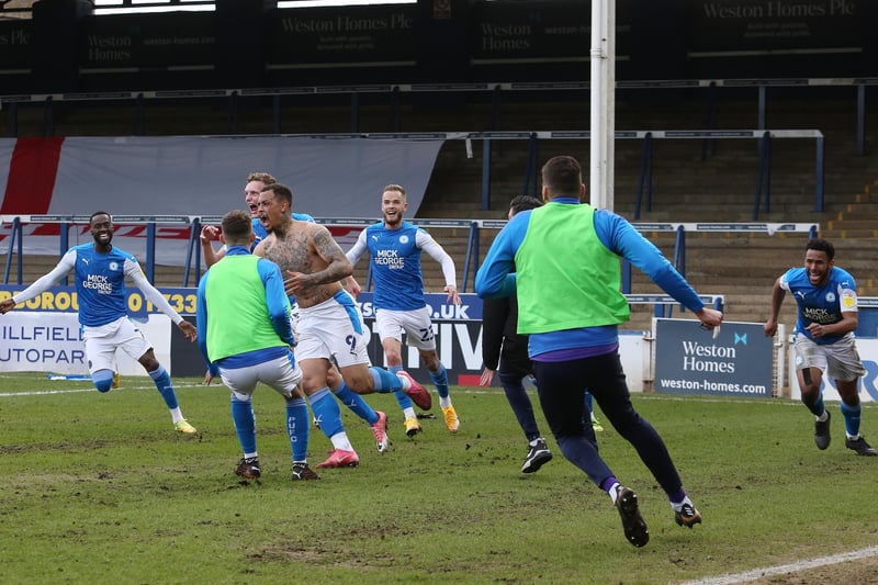 Pitch invasion after Jonson Clarke-Harris scores his stoppage time penalty. Photo: Joe Dent/theposh.com.
