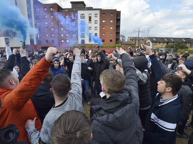 Posh drew with Lincoln City to gain promotion to the Championship triggering huge celebrations with fans outside the Weston Homes Stadium. Pictures: David Lowndes