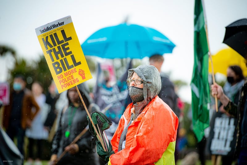 Eastbourne residents taking part in the 'Kill the Bill' march braved the rain on Saturday. SUS-210405-154812001