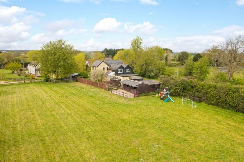 There is a timber storage barn/haybarn at the front of the plot has an attached corrugated iron former garage, and there is a timber barn with coal shed and garden store attached to the rear of the house.