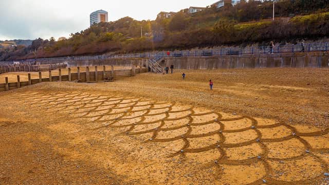 The sand drawing by Simon Perlaki on Eastbourne beach. Picture from Robert Trifan of RT Photography. SUS-210505-132956001