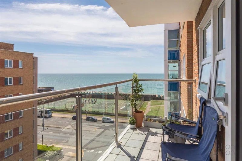 Dual aspect living room provides stunning views towards the sea and has access to a private balcony overlooking Hove lawns and the seafront.