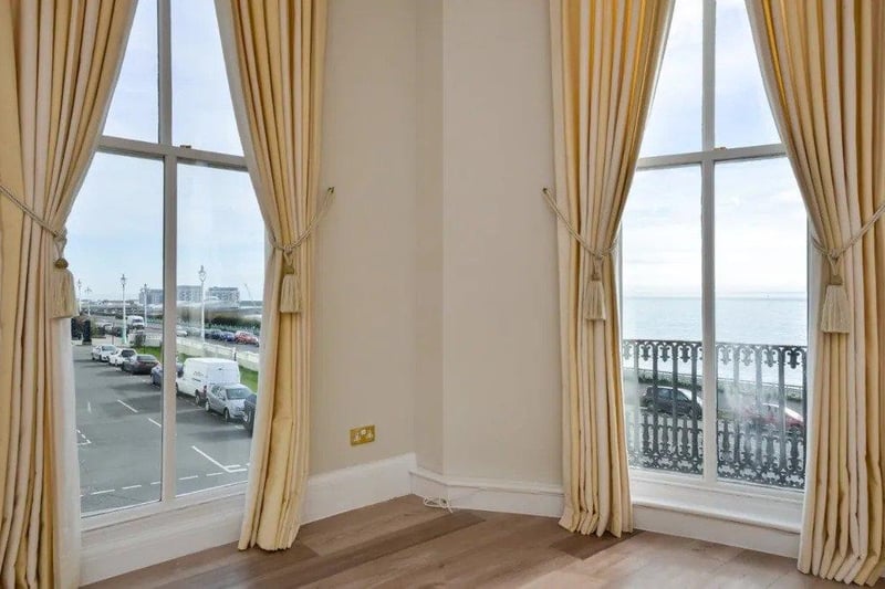 Panoramic sea views can be seen from several floor to ceiling windows and  balcony
