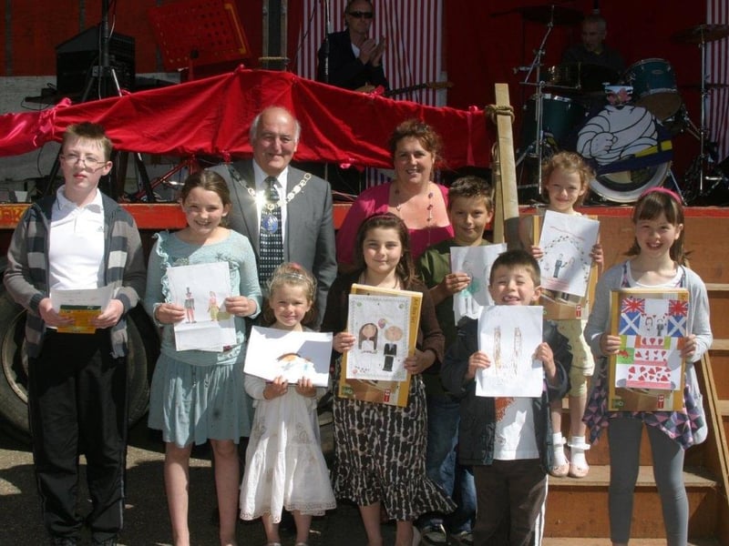 As part of Spilsby's May Day celebrations, Mayor David Pleming and chairman of Spilsby Business Partnership Angela Morgan-Knight presented prizes to local schoolchildren after a painting competition to mark the Royal Wedding.